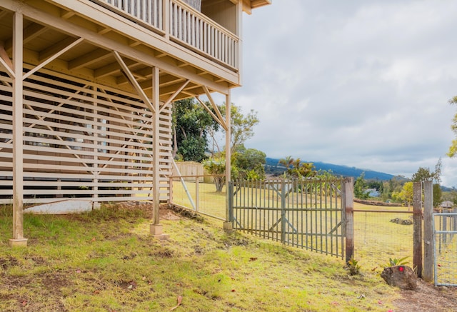 exterior space with fence and a lawn