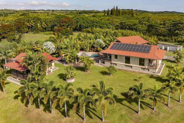 birds eye view of property with a forest view