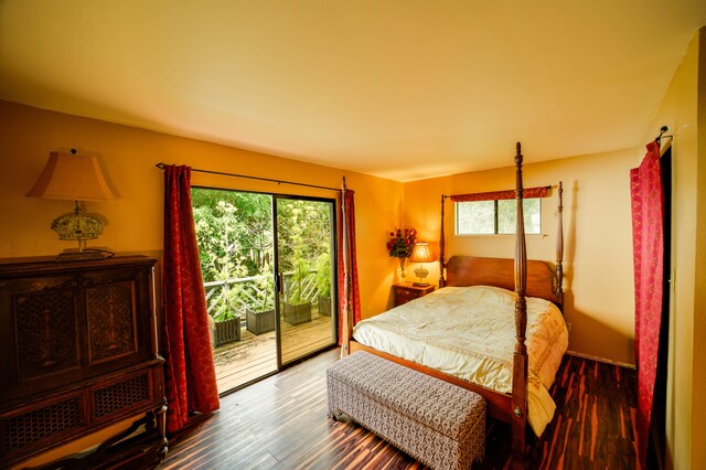 2239 Upper Kanaio Rd, Kula, HI 96790 - bedroom with access to outside, multiple windows, and wood finished floors