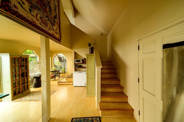 2239 Upper Kanaio Rd, Kula, HI 96790 - stairs featuring wood finished floors and lofted ceiling