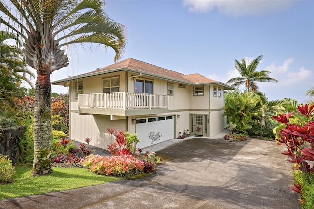 view of front of house featuring a garage and concrete driveway