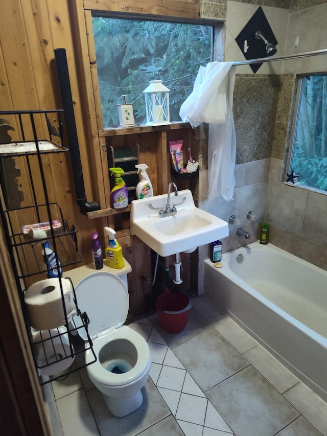 full bath featuring a sink, shower / tub combination, tile patterned flooring, and toilet