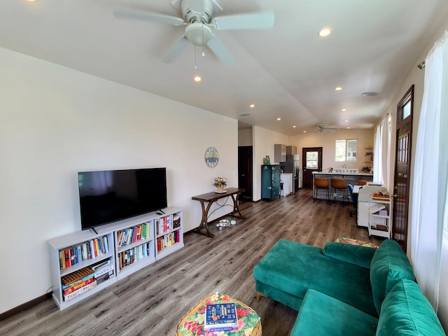 living area with lofted ceiling, ceiling fan, wood finished floors, and recessed lighting