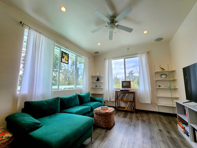 living room featuring lofted ceiling, wood finished floors, and recessed lighting