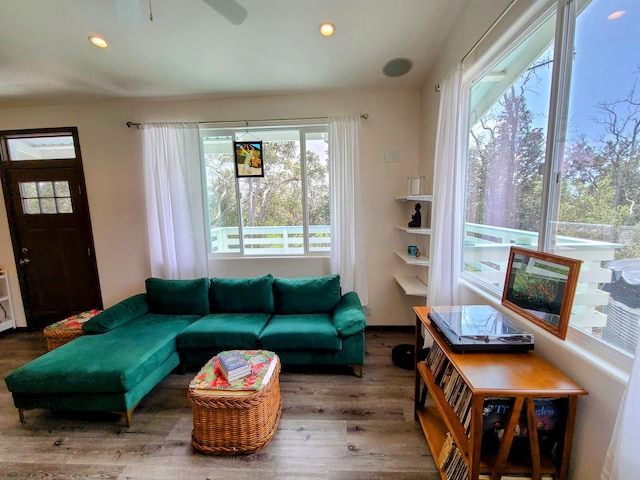 living room with recessed lighting, plenty of natural light, and wood finished floors