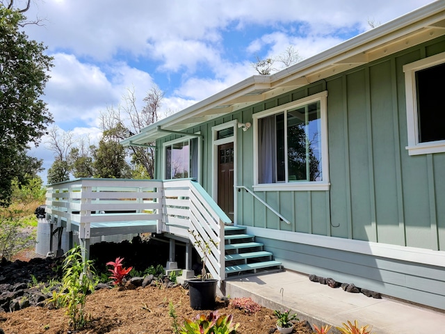 doorway to property with board and batten siding