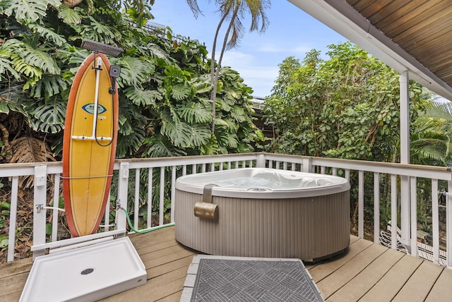 wooden terrace with a hot tub