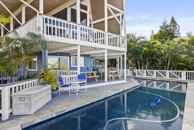 view of swimming pool featuring a fenced in pool, a patio, and fence