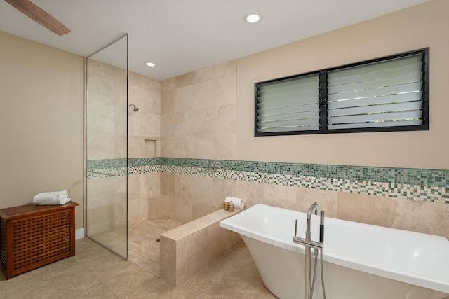 full bath with a soaking tub, tile patterned flooring, walk in shower, and recessed lighting