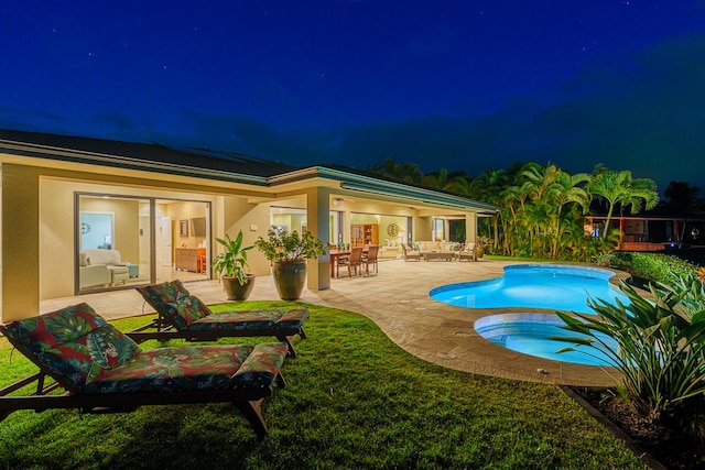 pool at twilight featuring a patio area, a lawn, outdoor lounge area, and an outdoor pool