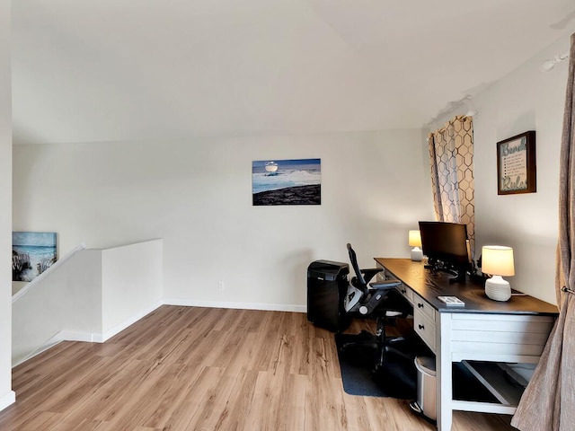 office area featuring baseboards and light wood-style floors