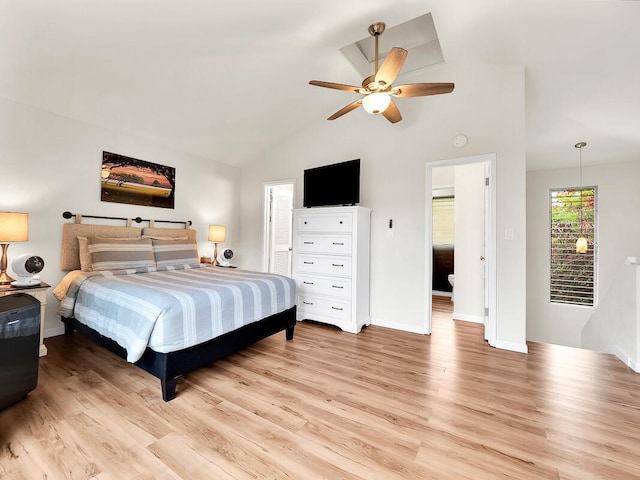 bedroom featuring a ceiling fan, light wood-type flooring, baseboards, and vaulted ceiling