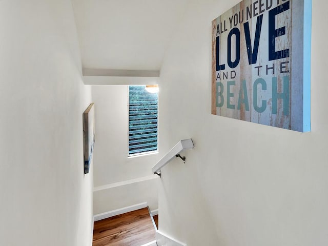 stairs with baseboards and wood finished floors