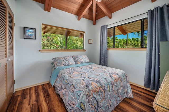 bedroom with wood ceiling, beamed ceiling, baseboards, and wood finished floors