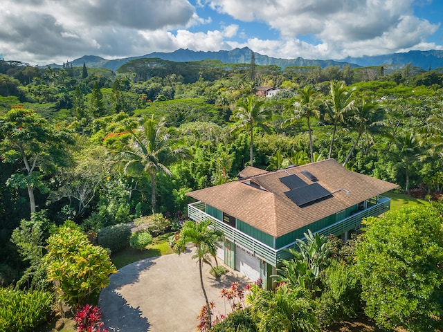 bird's eye view featuring a mountain view and a view of trees