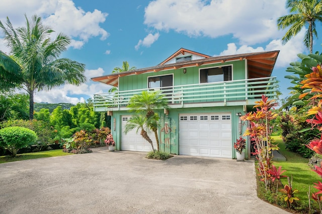 view of property featuring driveway and an attached garage