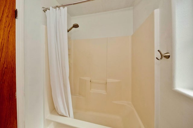 full bath with a shower with curtain