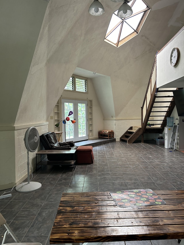 bonus room featuring stairs, lofted ceiling, and a skylight