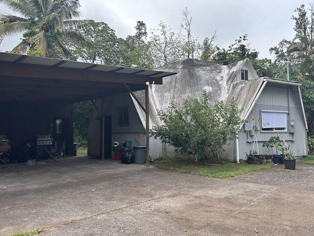 view of side of home with driveway