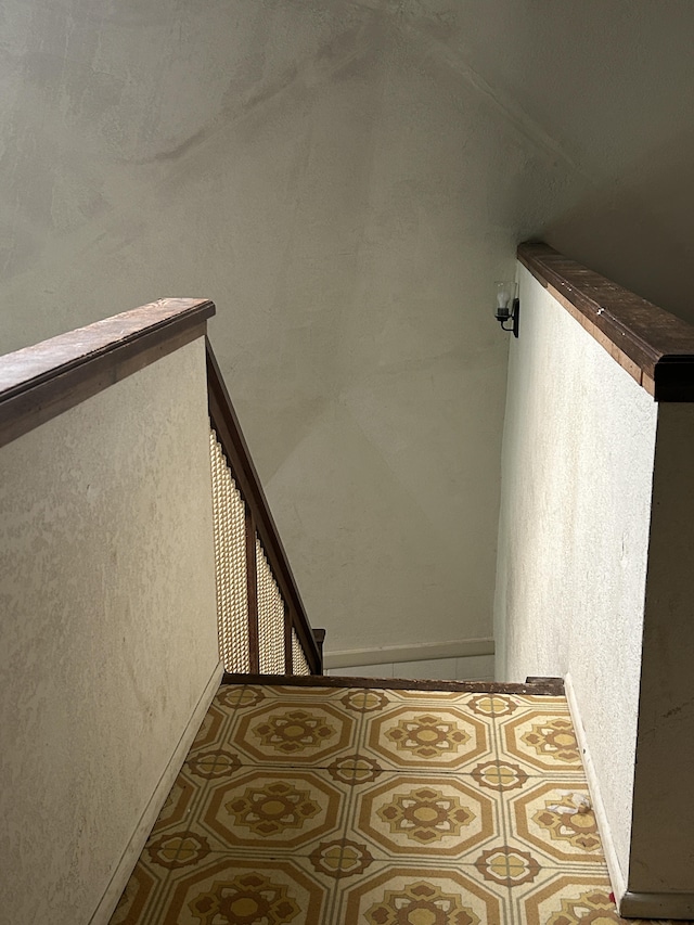 stairs featuring baseboards