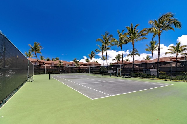 view of sport court with fence