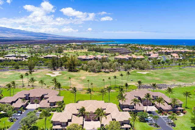 birds eye view of property with view of golf course and a residential view