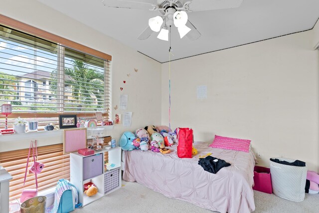 carpeted bedroom with ceiling fan