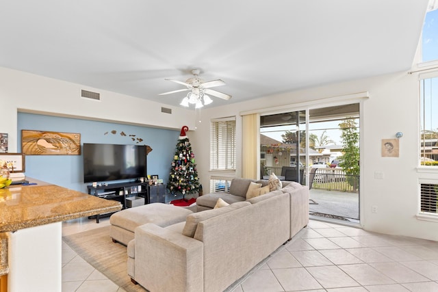 living room featuring visible vents, a ceiling fan, and light tile patterned flooring