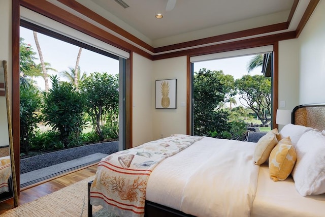 bedroom with ceiling fan and wood finished floors