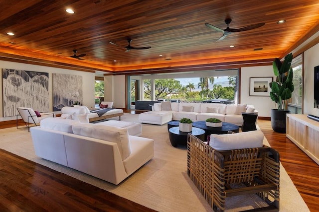 cinema room featuring recessed lighting, wooden ceiling, a raised ceiling, and wood finished floors