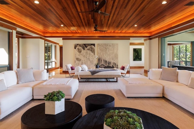 living room featuring wood ceiling, a tray ceiling, and recessed lighting