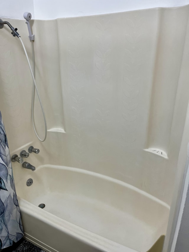 full bathroom with shower / tub combo