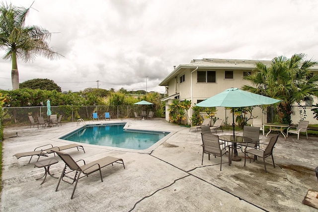 pool featuring a patio and fence