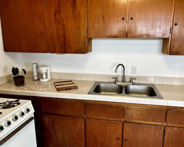 kitchen with light countertops and a sink