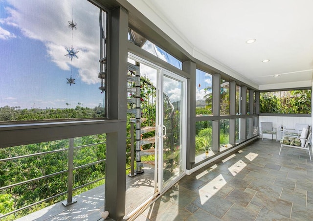 unfurnished sunroom with plenty of natural light