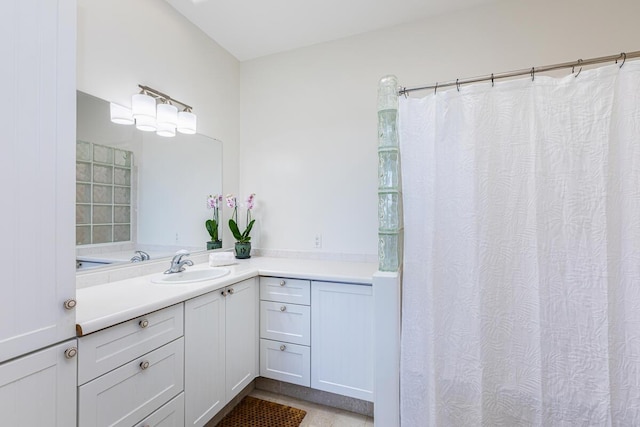 full bathroom with a shower with curtain and vanity