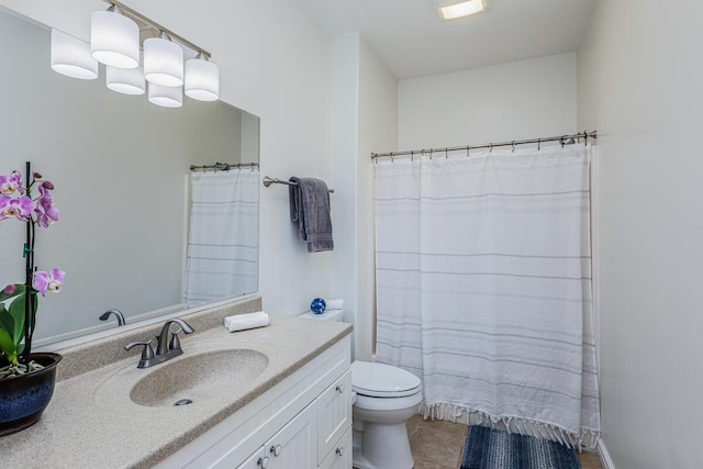 full bath with vanity, toilet, and tile patterned floors