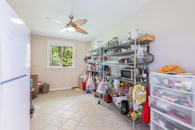 storage area with a ceiling fan