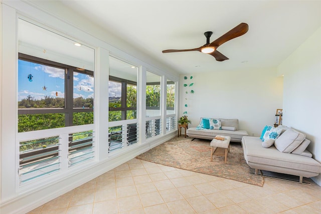 sunroom featuring a ceiling fan