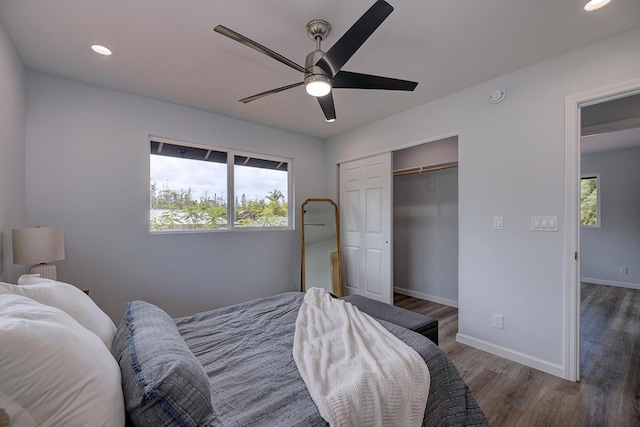 bedroom featuring recessed lighting, a closet, ceiling fan, wood finished floors, and baseboards