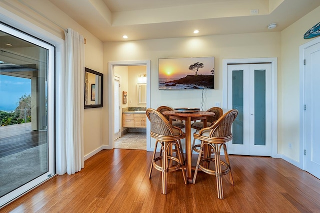 dining area featuring recessed lighting, french doors, baseboards, and wood finished floors