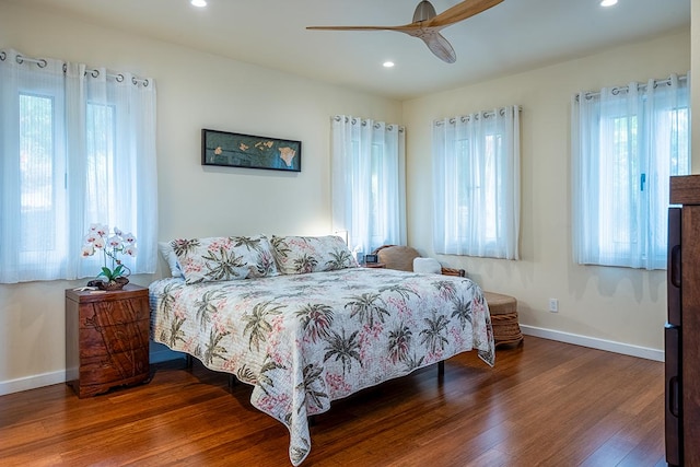 bedroom with recessed lighting, ceiling fan, baseboards, and wood finished floors