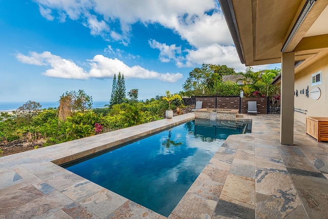 view of pool featuring a pool with connected hot tub and a patio