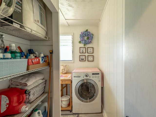 laundry room featuring washer / dryer and laundry area