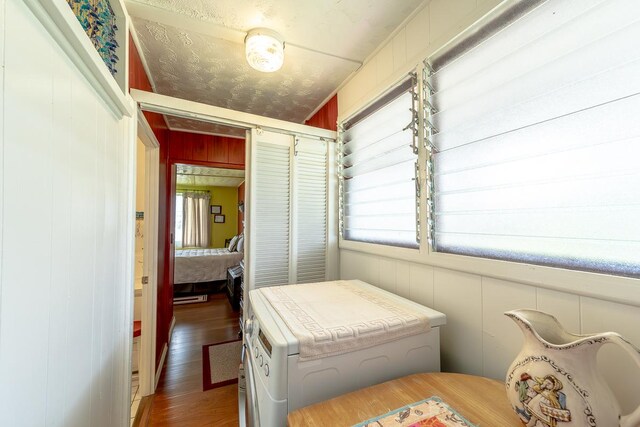 bedroom featuring dark wood-style floors and a closet