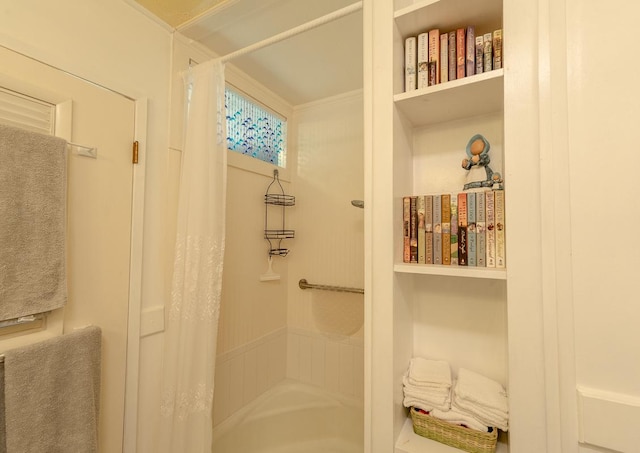 bathroom with shower / bath combo with shower curtain