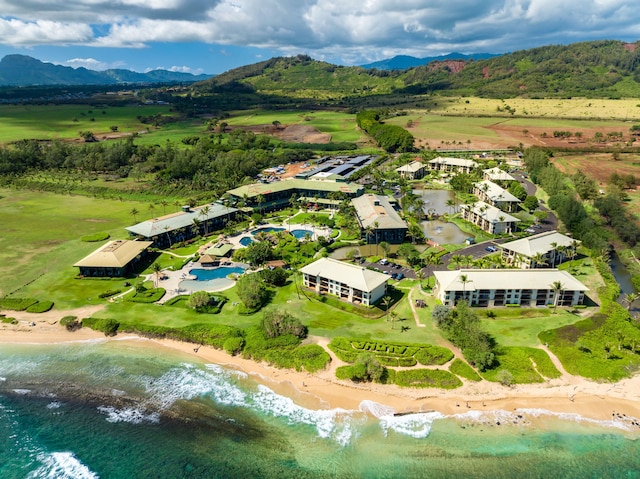 drone / aerial view featuring a water and mountain view