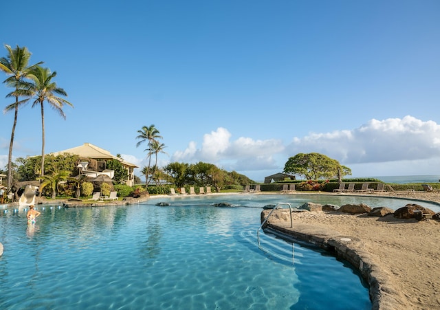 view of swimming pool with a water slide