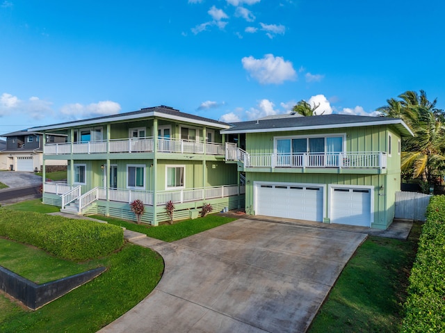 view of front of property featuring a shingled roof, concrete driveway, covered porch, a garage, and a balcony