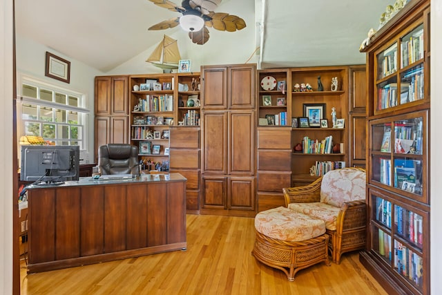 office area featuring lofted ceiling, light wood finished floors, and a ceiling fan